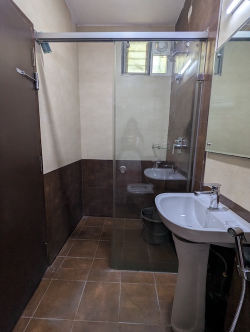 Clean, modern bathroom with premium amenities at our Koramangala hotel